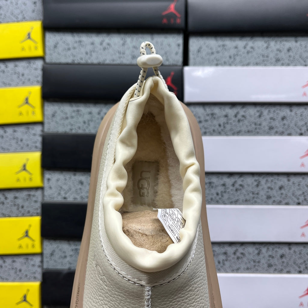 UGG Lowmel – Cream Pebbled Leather Slip-On with Sheepskin Lining & Tonal SugarSole