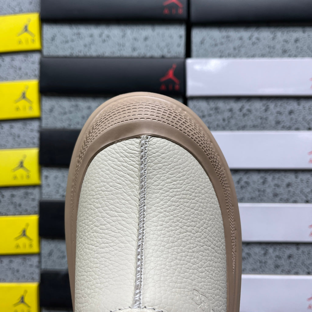 UGG Lowmel – Cream Pebbled Leather Slip-On with Sheepskin Lining & Tonal SugarSole
