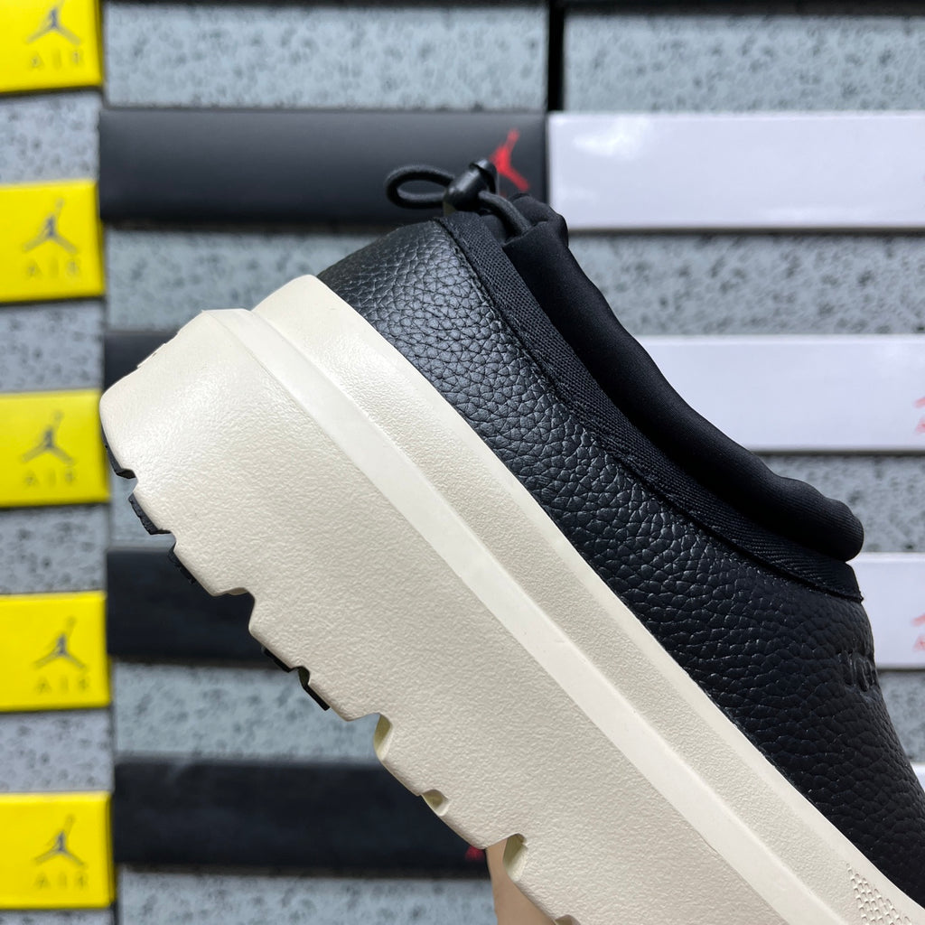 UGG Lowmel – Black Pebbled Leather Slip-On with Cream SugarSole & Sheepskin Lining