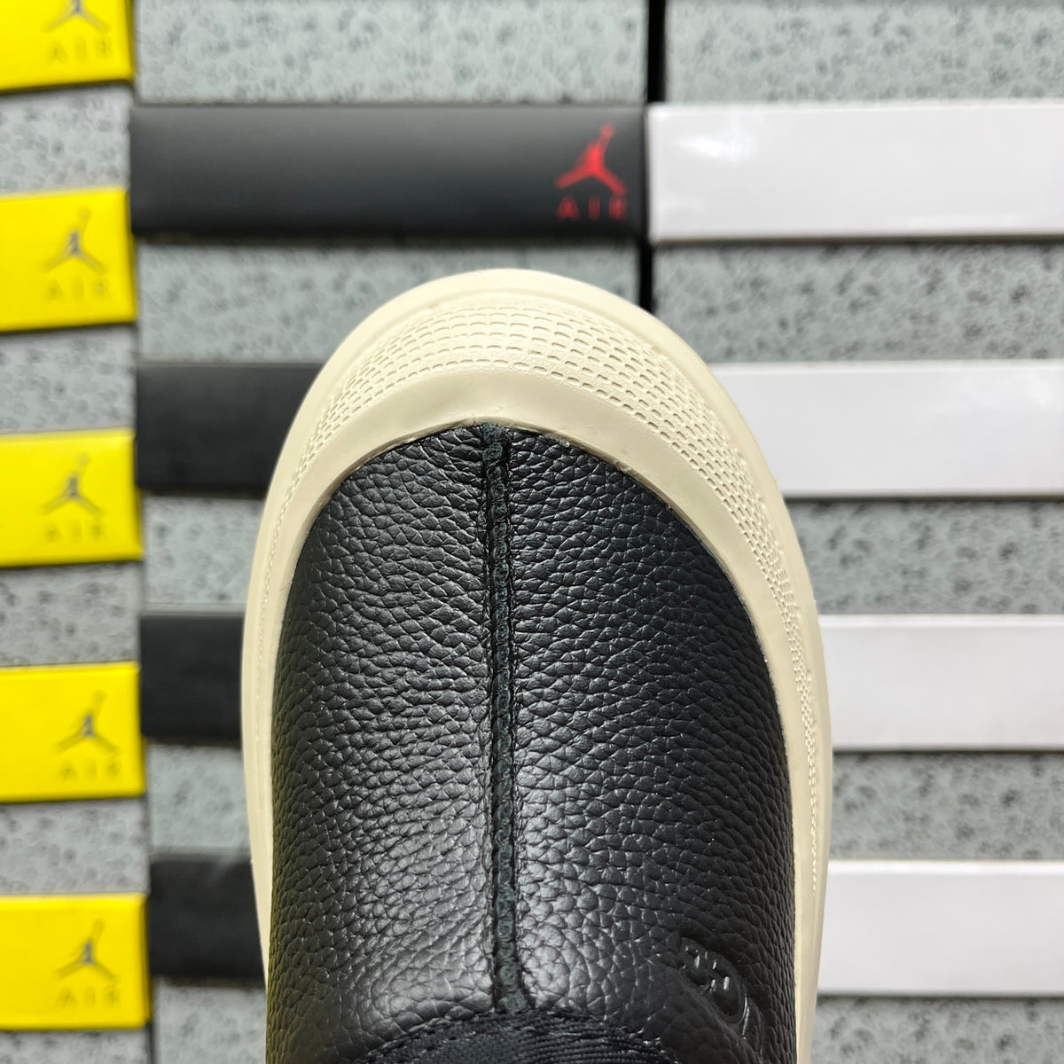 UGG Lowmel – Black Pebbled Leather Slip-On with Cream SugarSole & Sheepskin Lining