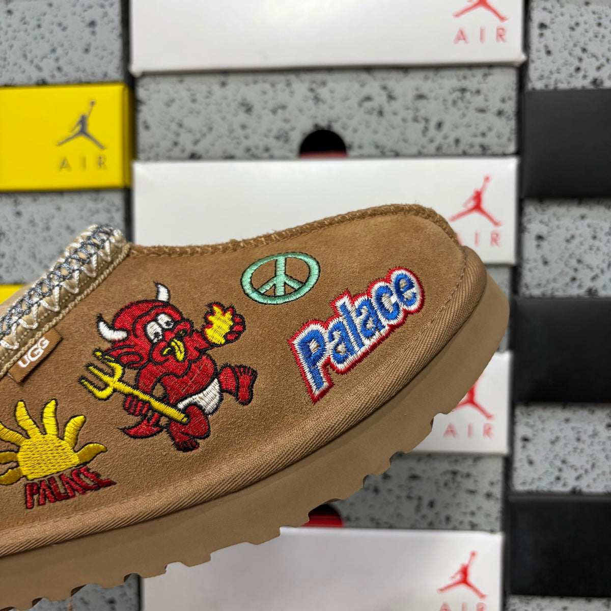 UGG × Palace Skateboards Tasman Slipper – Chestnut Suede with Embroidered Graphic Patches & Metallic Braid Trim